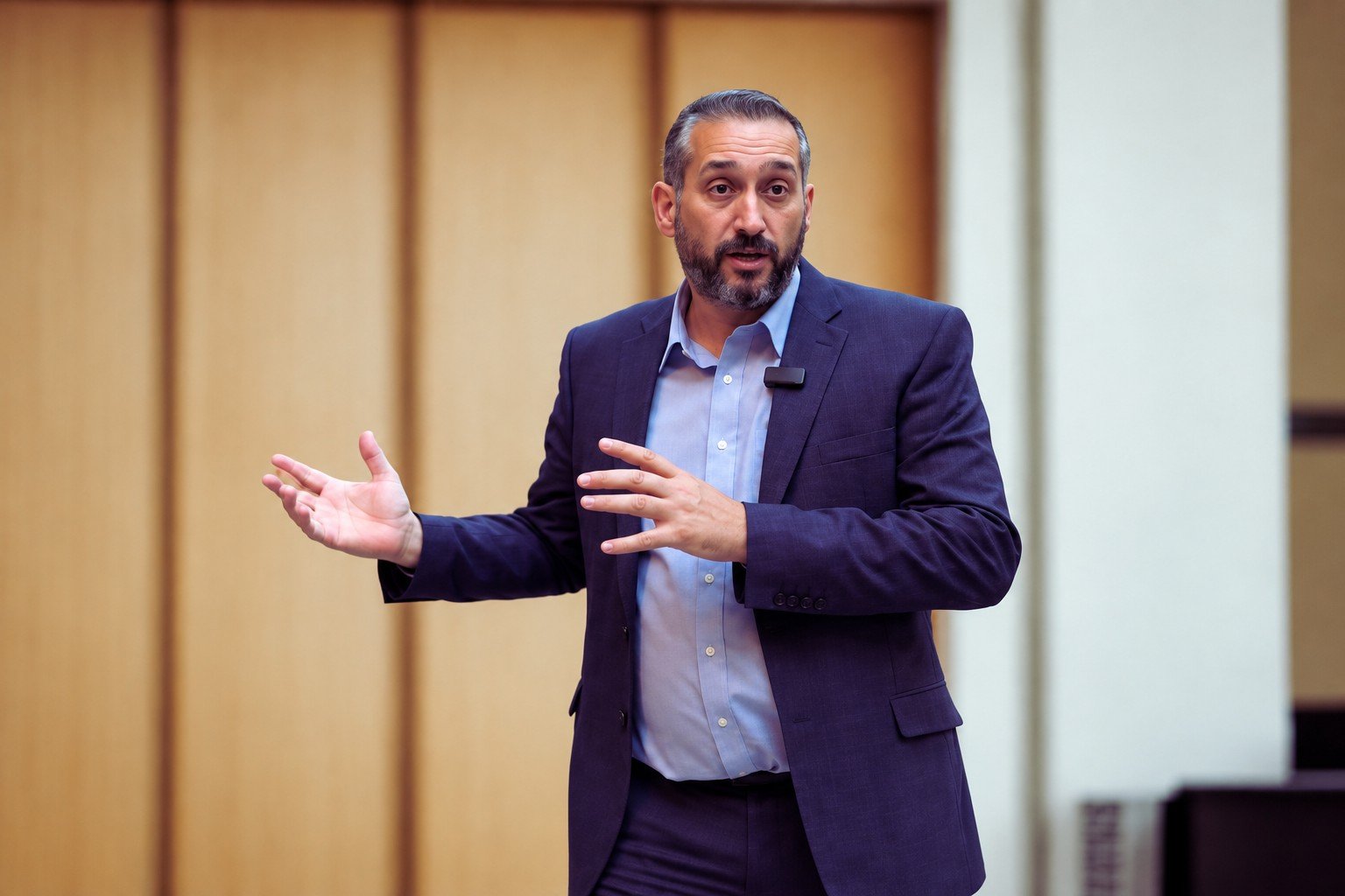 Phil Price delivering a business leadership presentation, sharing ideas and engaging with an audience.