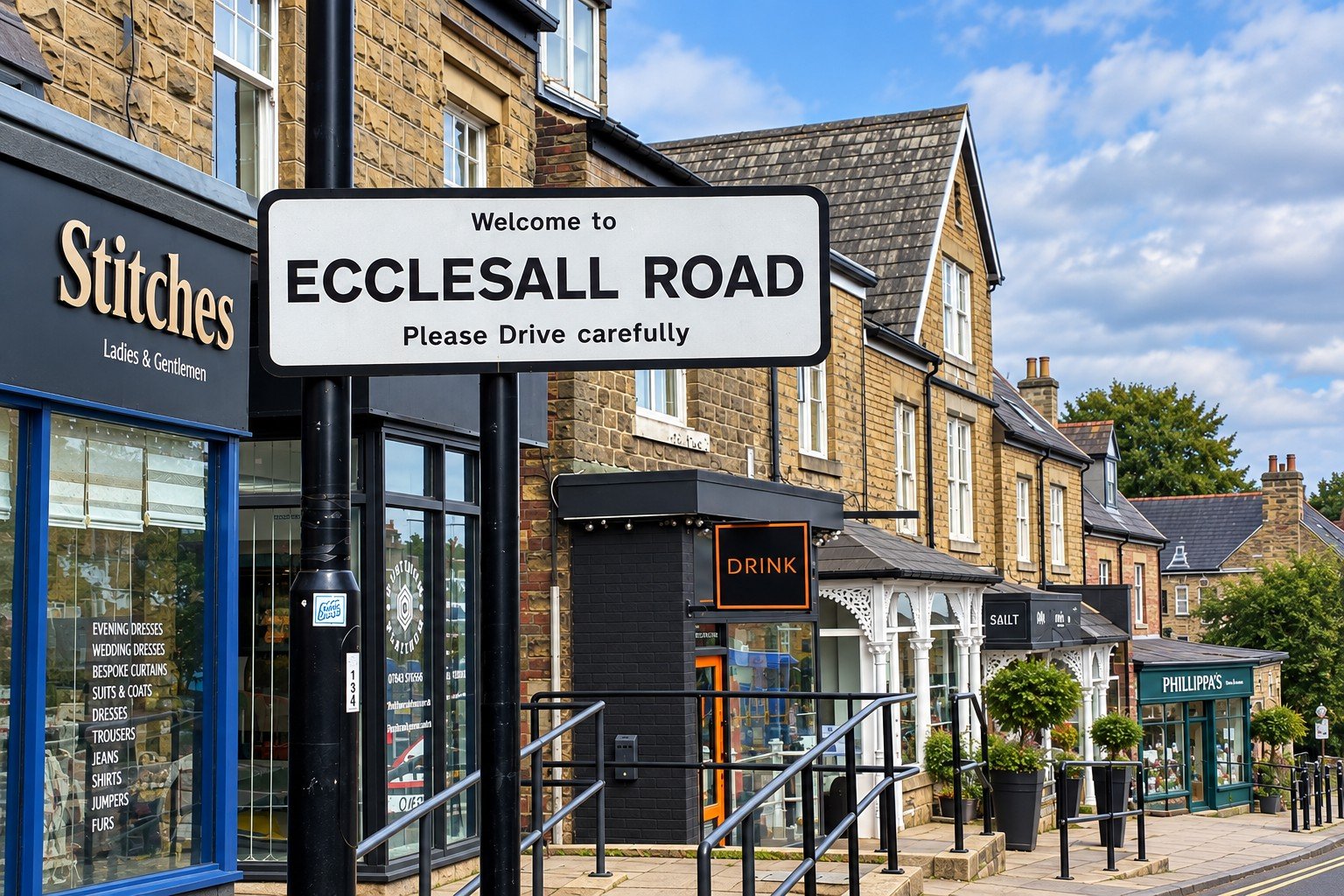 Welcome to Ecclesall Road sign overlooking independent shops and businesses in Sheffield.